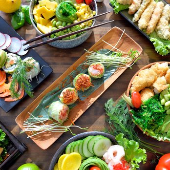 Hiro Sushi Poké - a variety of food on a wooden table - Japanese Near Me - Chambly, Quebec Hiro Sushi Poké - a variety of food on a wooden table - Japanese Near Me - Chambly, Quebec