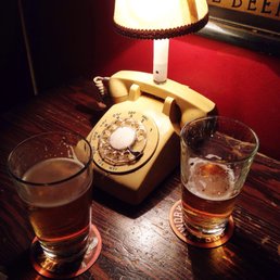 a telephone and two glasses of beer a telephone and two glasses of beer