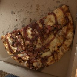 Small BBQ Chicken Bacon pizza. (Includes onions and half eaten) Ask to have it cut in squares!