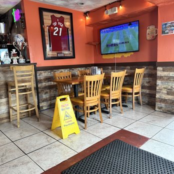 Adelitas Cafe - a bar with a television - Honduran Near Me - Miami, Florida