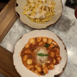 Nina Pasta Bar - Carbonara and their gnocchi with parmesan cheese from our first visit.