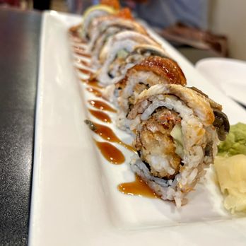 Thai Chef - a long sushi roll on a white plate - Thai Near Me - Schertz, Texas Thai Chef - a long sushi roll on a white plate - Thai Near Me - Schertz, Texas