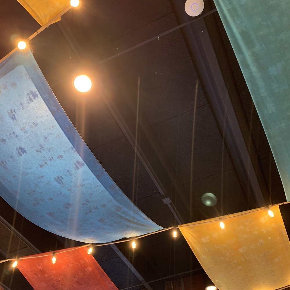 Noche Restaurant & Bar - a ceiling with colorful cloths hanging from the ceiling - Tapas/Small Plates Near Me - Greendale, Wisconsin Noche Restaurant & Bar - a ceiling with colorful cloths hanging from the ceiling - Tapas/Small Plates Near Me - Greendale, Wisconsin