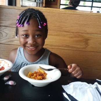 Pizza Hut - a little girl sitting at a table with two bowls of food - Pizza Near Me - Hermitage, Pennsylvania