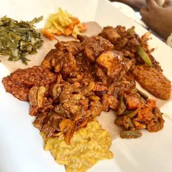 Das Ethiopian - Chicken Infillay (middle), Lamb Tibs (top middle), Kik Alicha (bottom right), Tikil Gomen, Gomen (bottom left), Red Lentil (middle bottom) - Ethiopian Near Me - Washington, DC, District of Columbia