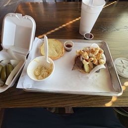 Brisket sandwich, mac & cheese, with the spicy and regular sauce and some sweet tea