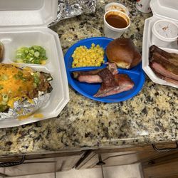 Colter's Texas BBQ - Pulled pork baked potato, kids rib plate, and 3 meat plate.
