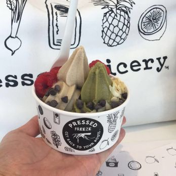 Pressed Juicery - This was my friends Freeze. Vanilla and Matcha flavor! She also had raspberries, chocolate chips, and almond slices for toppings. - Juice Bars & Smoothies Near Me - Carlsbad, California