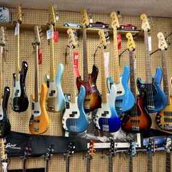 Southpaw Guitars - Fender Left-handed Guitars wall at Southpaw Guitars.