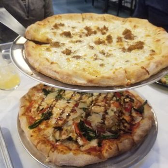 Ghost Box Pizza by Stem Ciders - Wood-fired pizzas, cheese and sausage top, Veggie bottom - Pizza Near Me - Lafayette, Colorado