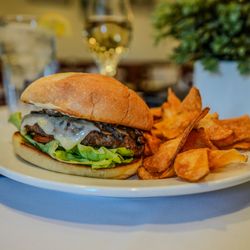Orange Blossom Hills Golf & Country Club Restaurant - Mushroom Swiss burger with chips.