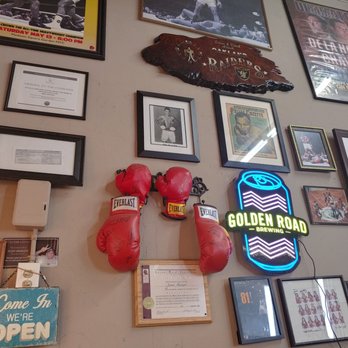 Oak Street Barber Shop - Look at this cool ass wall! - Barbers Near Me - Bellflower, California