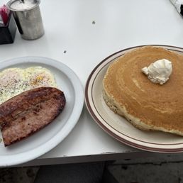 Number 18. Two eggs, choice of meat and two stack of pancakes Number 18. Two eggs, choice of meat and two stack of pancakes