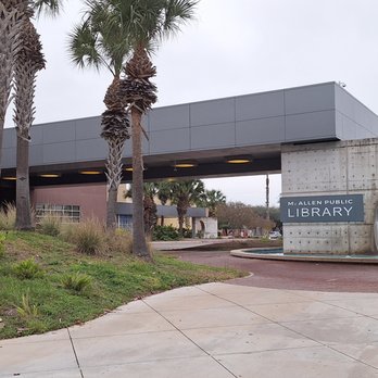 McAllen Public Library - Water feature inside round arch dripping into fountain and changing color show inside glass tower - blue - (2 of 5) - Libraries Near Me - McAllen, Texas