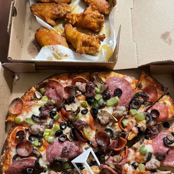 Mountain Mike's Pizza - a pizza with a slice missing - Pizza Near Me - Santa Clara, California