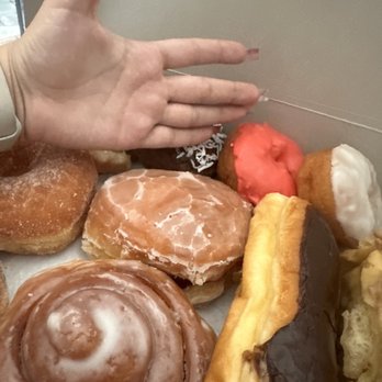Ontario Donuts - Hand comparison to the donuts - Donuts Near Me - Ontario, California