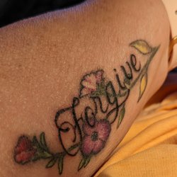 Biery's Port Tattoo Studio - Jon was able to come up with an amazing design that included my family. FORGIVE is my word! Every leaf and flower represents someone
