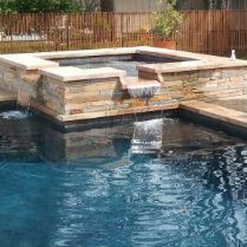 Open Water Pools and Spas - a pool with a fire pit - General Contractors Near Me Open Water Pools and Spas - a pool with a fire pit - General Contractors Near Me