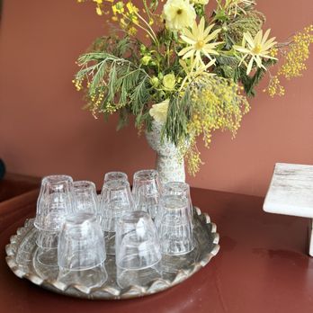 Loquat - Water glasses and flower arrangement at Loquat - Bakeries Near Me - San Francisco, California Loquat - Water glasses and flower arrangement at Loquat - Bakeries Near Me - San Francisco, California