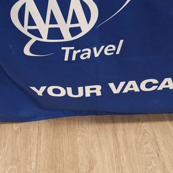 AAA - Table across from her - Travel Services Near Me - Huntington Beach, California