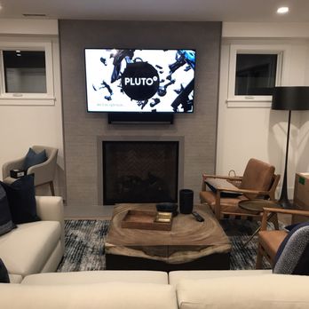 Comm Plus Computer & Home Theater Services - Hung 65" TV and Sonos Play Bar into concrete fireplace. - Home Theatre Installation Near Me Comm Plus Computer & Home Theater Services - Hung 65" TV and Sonos Play Bar into concrete fireplace. - Home Theatre Installation Near Me