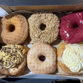 Oliboli Donuts - Top L-R: Cinnamon Sugar, Butter Pecan, Bumbleberry Glazed, Bottom L-R: Coffee Crunch, Meyer Lemon Glaze, Banoffee - Donuts Near Me - Tustin, California Oliboli Donuts - Top L-R: Cinnamon Sugar, Butter Pecan, Bumbleberry Glazed, Bottom L-R: Coffee Crunch, Meyer Lemon Glaze, Banoffee - Donuts Near Me - Tustin, California