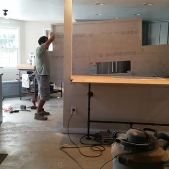 Remodeling Plus - The guys lifted this monster between that load bearing beam and the kitchen wall! - Countertop Installation Near Me - Riverside, California