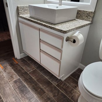 Pelle Construction - a bathroom with a sink and toilet - General Contractors Near Me