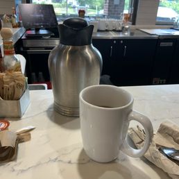 Steaming cup of coffee at the bar!