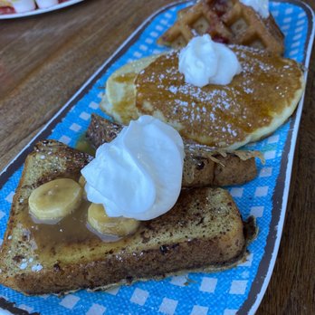 Countryside Cafe - One of my favorite dish is the Walk Through the Country Banana fosters French toast, Liliko'i buttermilk pancakes, and strawberry. - Breakfast & Brunch Near Me - Waianae, Hawaii Countryside Cafe - One of my favorite dish is the Walk Through the Country Banana fosters French toast, Liliko'i buttermilk pancakes, and strawberry. - Breakfast & Brunch Near Me - Waianae, Hawaii