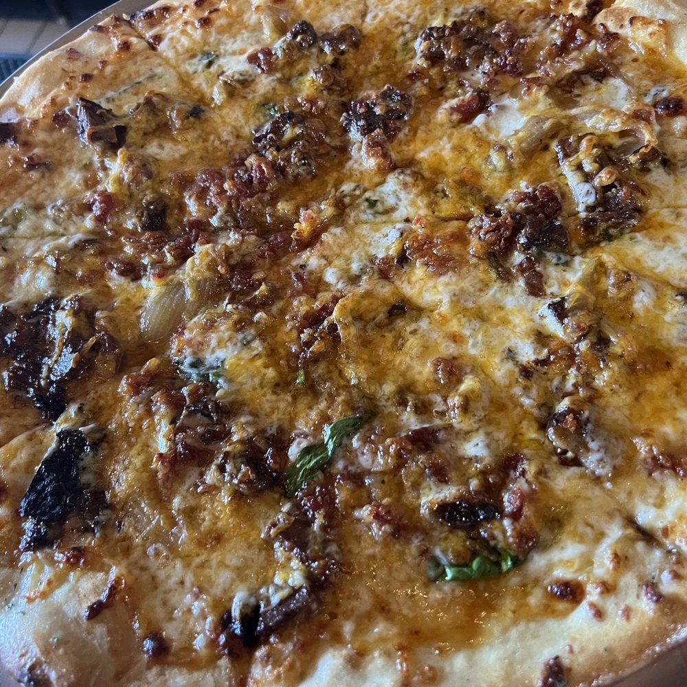 Evolution Craft Brewing Co. & Public House - Brisket Melt pizza the sriracha has the characteristics of the lingering heat with slight sweet tang with the brisket...makes this so good. - New American Near Me - Salisbury, Maryland