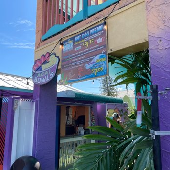The Cooler - a colorful building with a sign for a restaurant - Acai Bowls Near Me - Clearwater, Florida