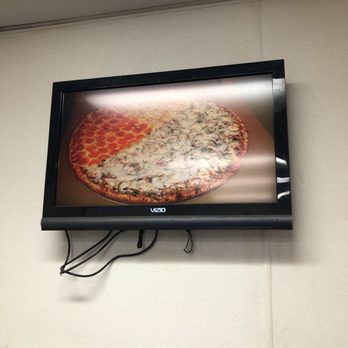 Santa's Pizza - This is pic from the looping video at Santa's pizza - they can split the toppings even into 4 quarter sections - Pizza Near Me - Covina, California Santa's Pizza - This is pic from the looping video at Santa's pizza - they can split the toppings even into 4 quarter sections - Pizza Near Me - Covina, California