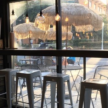 Smoqehouse - tiki umbrellas outside - Barbeque Near Me - Bradenton Beach, Florida