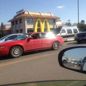 McDonald's - a red car driving past a mcdonald's - Fast Food Near Me - McAllen, Texas McDonald's - a red car driving past a mcdonald's - Fast Food Near Me - McAllen, Texas