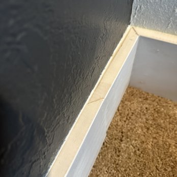 Transfer Hands - Upstairs. Baseboards clearly not aligned. - General Contractors Near Me