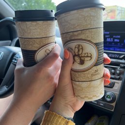 two coffee cups in a car two coffee cups in a car