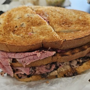 Attman's Delicatessen - Lombard Street, toasted rye bread. Regular cut pastrami + corned beef, chopped liver (sweet) and Russian dressing. To go order. - Delis Near Me - Baltimore, Maryland