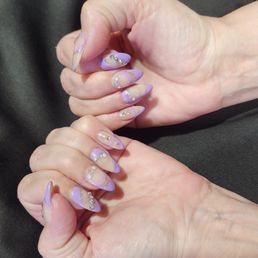 Violet color with a variety of styles for each nail with silver glitter and little bling gem stones. Violet color with a variety of styles for each nail with silver glitter and little bling gem stones.