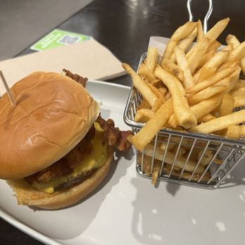 Wahlburgers - Plain bacon cheese burger and crispy fries. They use "government" cheese - Burgers Near Me - Boston, Massachusetts Wahlburgers - Plain bacon cheese burger and crispy fries. They use "government" cheese - Burgers Near Me - Boston, Massachusetts