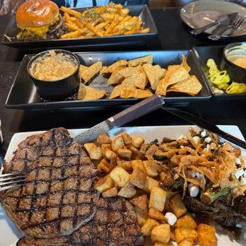 Wolfhounds Bar & Grill - Double smash burger and fries; ribeye, potatoes, and roasted brussels sprouts - Sports Bars Near Me - Salem, Oregon Wolfhounds Bar & Grill - Double smash burger and fries; ribeye, potatoes, and roasted brussels sprouts - Sports Bars Near Me - Salem, Oregon