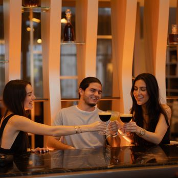 Gala Restaurant & Muse Bar - Three friends cheers with espresso martinis at a stylish bar. - Cocktail Bars Near Me - Aventura, Florida Gala Restaurant & Muse Bar - Three friends cheers with espresso martinis at a stylish bar. - Cocktail Bars Near Me - Aventura, Florida