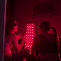 The Wellbeing Visit - Redlight therapy post jiu-jitsu training. Wellness event for women's group