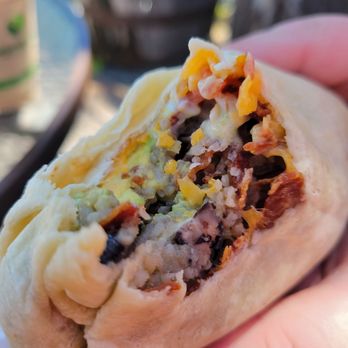 The Dam Cafe - a hand holding a burrito - Coffee & Tea Near Me - Tahoe City, California The Dam Cafe - a hand holding a burrito - Coffee & Tea Near Me - Tahoe City, California