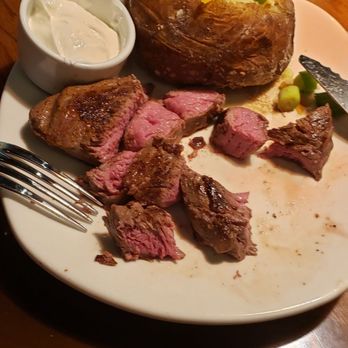 Outback Steakhouse - Center cut medium steak and loaded baked potato - Steakhouses Near Me - Winter Park, Florida Outback Steakhouse - Center cut medium steak and loaded baked potato - Steakhouses Near Me - Winter Park, Florida