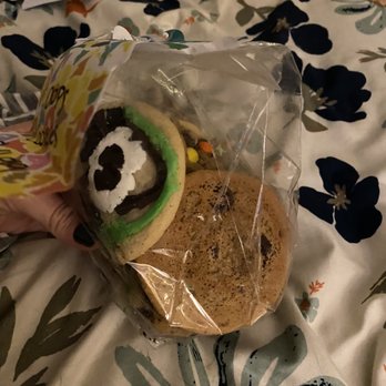 Great American Cookies - a hand holding a bag of cookies - Desserts Near Me - Tulsa, Oklahoma