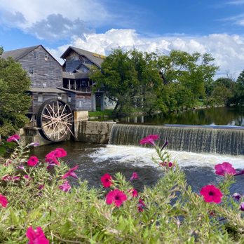 Mill Bridge Hard Cider Company - View across the patio, sit outside on the river and enjoy a drink - Wine Tasting Room Near Me - Pigeon Forge, Tennessee Mill Bridge Hard Cider Company - View across the patio, sit outside on the river and enjoy a drink - Wine Tasting Room Near Me - Pigeon Forge, Tennessee