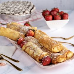 Grand and Essex Market - Our homemade blintzes topped with strawberries & powdered sugar