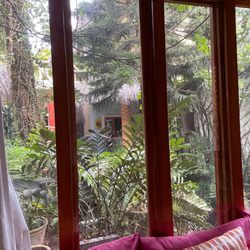 Hotel Vogue - Looking out for window from living area in our bungalow.