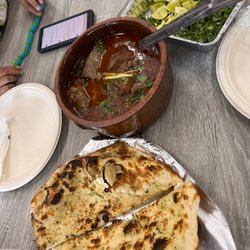 Sam's Halal Market & Restaurant - Garlic Naan, Nihari, & toppings for Nihari(lime, ginger, green chili, onion, & cilantro)